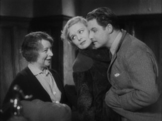 Pamela (Madeleine Carroll) and Hanny (Robert Donat) pose as a newlywed couple as they try to hide the fact that they are handcuffed to one another from an innkeeper.