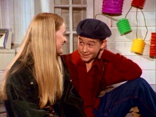 Tommy (Joseph Gordon-Levitt) charms his first season girlfriend August (Shay Astar) in a beret.