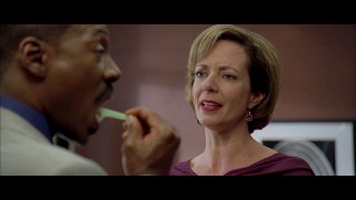 Jack (Eddie Murphy) tries flossing his way out of answering his boss (Allison Janney) in this deleted scene.