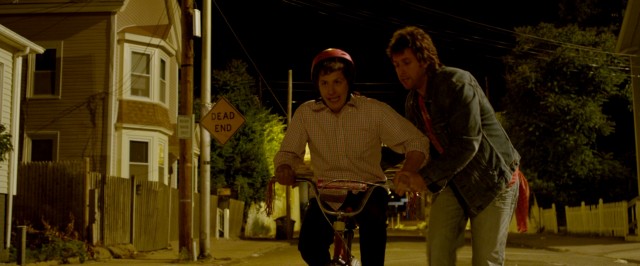 Donny (Adam Sandler) seizes their night together to teach Todd (Andy Samberg) to ride a bike.
