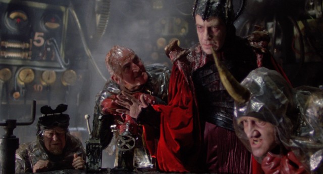 Surrounded by idiots, the genius Evil (David Warner) finds it difficult to lure the Time Bandits to the Fortress of Ultimate Darkness.