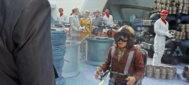 In a secret area of the 1964 New York World's Fair, young Frank Walker (Thomas Robinson) shows off his jet pack.