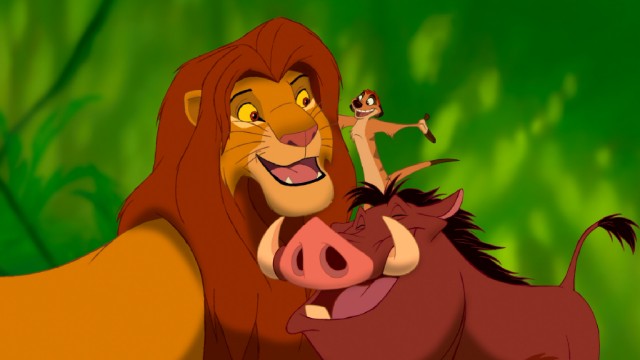 Newly grown-up Simba sings "Hakuna Matata" with his carefree new best friends Timon and Pumbaa in "The Lion King."