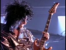 Steve Stevens is the very model of a 1980s rock star as he jams out the "Top Gun Anthem" on his electric guitar.