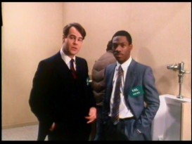 Dan Aykroyd and Eddie Murphy promote their film from a bathroom for the annual ShoWest exhibitors' convention in Las Vegas.