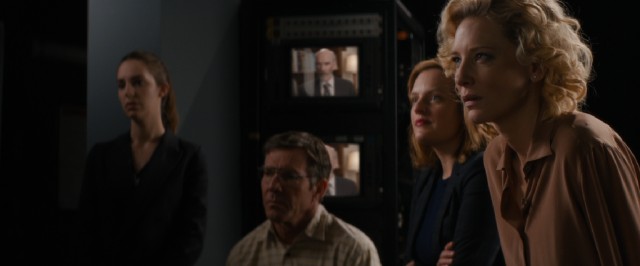 Mary Mapes (Cate Blanchett) and her staff (Dennis Quaid and Elisabeth Moss) watch as their report is called into question.