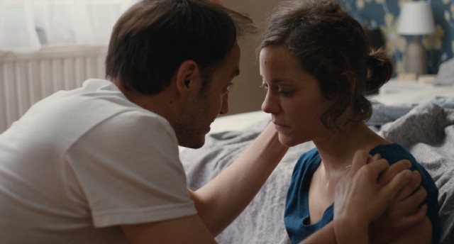 Manu (Fabrizio Rongione) encourages his depressed wife Sandra (Marion Cotillard) to fight for her job.