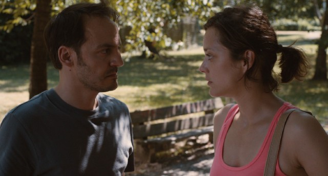 Manu (Fabrizio Rongione) and Sandra (Marion Cotillard) share a moment outside in "Two Days, One Night."