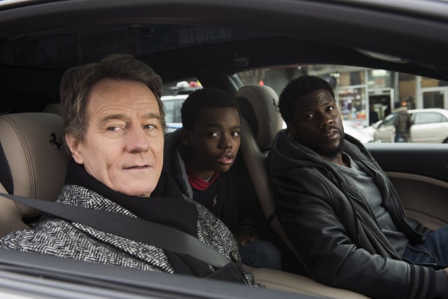 Phillip (Bryan Cranston) and Dell (Kevin Hart) share a moment in one of Phillip's fancy  cars with Dell's son Anthony (Jahi Di'allo Winston).