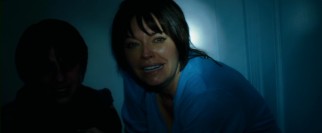New stepmother Angela (Mussetta Vander, not completely hiding an accent) gets terrorized in bathrobe during a blackout.