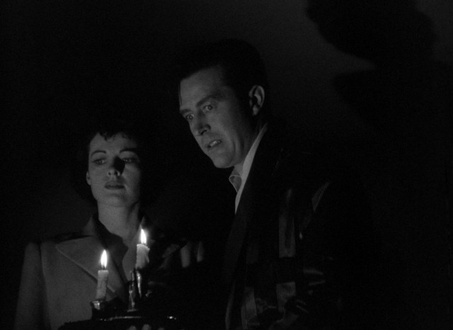 Siblings and housemates Pamela (Ruth Hussey) and Roderick Fitzgerald (Ray Milland) get a fright in the middle of the night in the 1944 ghost thriller "The Uninvited."
