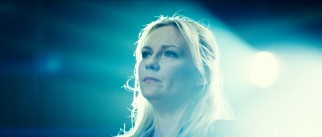 Amnesiac Eden Moore (Kirsten Dunst) is not happy to recognize a familiar face performing a demonstration upside down.