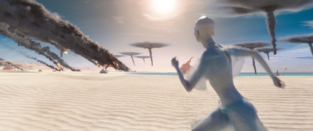 An alien runs to safety as her planet is attacked in "Valerian and the City of a Thousand Planets."