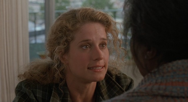 In an attempt to save the day, Rita Baker (Nancy Travis) questions her crazy Elvis-worshipping neighbor.