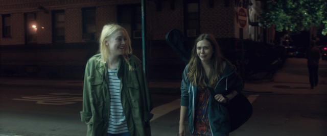 Her relationship with David a secret, Lilly (Dakota Fanning) is able to share a post-concert laugh with best friend Gerry (Elizabeth Olsen).
