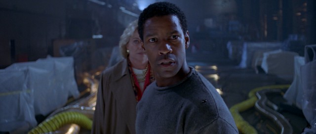 "Virtuosity" stars Denzel Washington as Parker Barnes, an LAPD detective turned prison inmate set free to capture a computer-engineered menace.