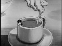 Mickey, finally mouse-like in size, struggles to free himself from a giant's beverage in "Giantland," Disney's first take on "Jack and the Beanstalk."