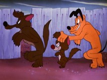Pluto sneaks behind Coyote and Son in "Pests of the West."