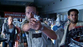 Andrea (Laurie Holden), Rick (Andrew Lincoln), and Morales (Juan Pareja) prepare to defend themselves against department store zombies.