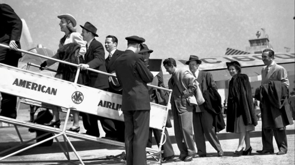 Walt and El Grupo board an American Airlines plan to return to California, or else they're simply staging that effect.
