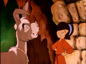 The Judean boy cracks a smile at his donkey Small One's inability to hold his ears straight in Disney's 1978 Christmas short "The Small One."