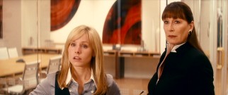 As run-of-the-mill romcoms often do, this one shows us the leading lady's work life, where Anjelica Huston plays Beth's demanding boss Celeste.