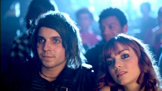 That apparently isn't Emma Stone playing the girlfriend of Friday Night Boys singer Andrew Goldstein. When he goes to the concession stand, she's badgered by the guys behind her in the "Stupid Love Letter" music video.