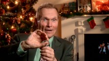 In front of a decorated Christmas tree and electronic fireplace, USC professor and go-to DVD interview subject Dr. Drew Casper acts out one of his moments from the film in "Backstage Stories."