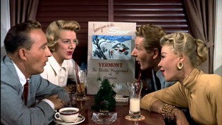 In the dining car of a train headed for Vermont, our four leads (left to right, Bing Crosby, Rosemary Clooney, Danny Kaye, and Vera-Ellen) sing of the wonders of snow.