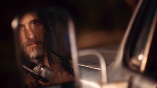 Uncle Teardrop (John Hawkes) is reluctant to put down his weapon and step out of his truck for the suspicious Sheriff Baskin.