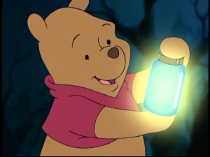 Winnie the Pooh admires the glowing power of the Smitten lightning bug he has just harnessed.