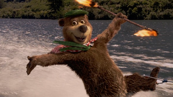 This can't end well. Yogi Bear twirls a fire baton while jet-skiing on Jellystone Lake.