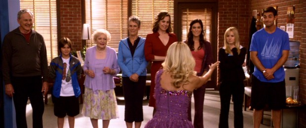 Wedding planner Georgia King (Kristin Chenoweth) makes a grand entrance before the Olsen-Clark wedding party, dancing to The Black Eyed Peas' "Pump It."