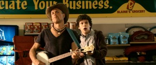 Tallahassee (Woody Harrelson) uses a banjo to attract grocery store zombies, while Columbus (Jesse Eisenberg) stands back ready to fire.