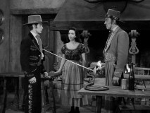 Stranger Carlos Murietta (Kent Taylor) challenges young Don Rudolfo (Steve Stevens) to a duel to the death, with waitress Maria Crespo (Myrna Fahey) in the middle of the dispute.