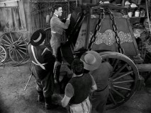 The town comes out to admire Sgt. Garcia's one thousand pound iron box, made specially for transporting tax money to the governor.