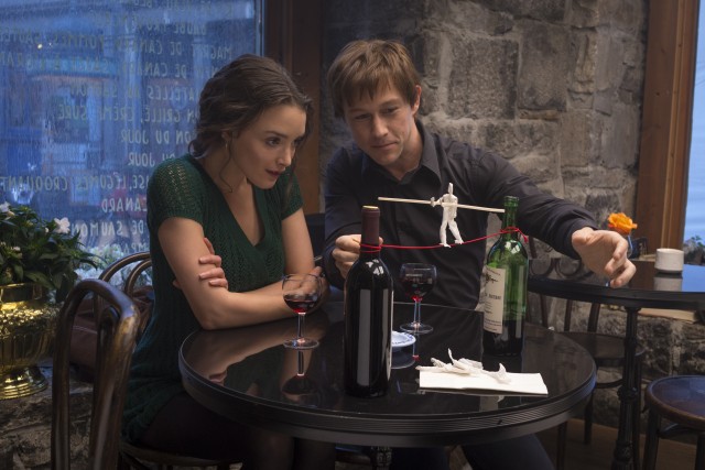 Philippe (Joseph Gordon-Levitt) uses a string and two bottles of wine to demonstrate his plans for "The Coup" to his girlfriend Annie (Charlotte Le Bon).