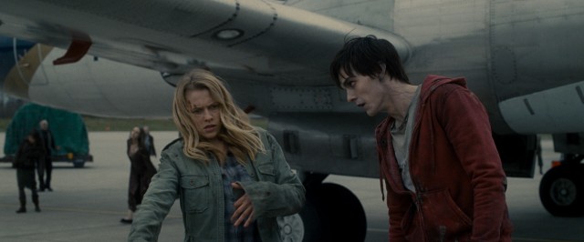 In "Warm Bodies", R (Nicholas Hoult) informs Julie (Teresa Palmer) that her attempt to blend in with his fellow airport runway zombies is a bit over the top.