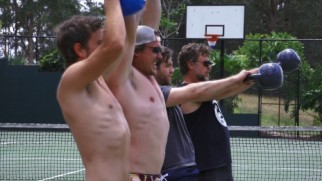 Just one of the boys: Russell Crowe lifts a kettlebell with his on-screen sons.