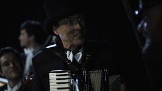 Weird Al and company persist at treating the sinking Titanic to live music in "And the Band Played On."