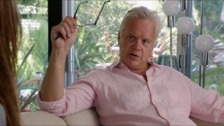 A white-haired Tim Robbins plays Alice's therapist Dr. Daryl Moffet.