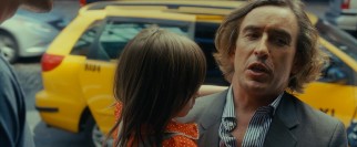 Mr. Beale (Steve Coogan) shares some condescension with his ex's new husband while picking up Maisie.