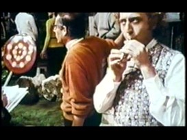 Gene Wilder practices his flute-playing skills in between takes on the Chocolate Room set, a sight captured in "A World of Pure Imagination."