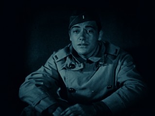 Jack Powell (Charles "Buddy" Rogers) looks into a rescue of his friend in one of the film's blue-tinted sequences.