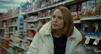 Mike's wife Jackie Flaherty (Amy Ryan) finds herself warming to her young extended houseguest on a shared supermarket run.