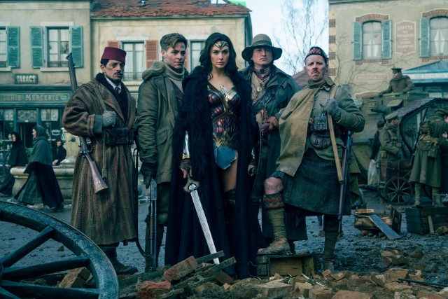 Diana Prince (Gal Gadot) poses with her multicultural allies (Said Taghmaou, Chris Pine, Eugene Brave Rock, and Ewen Bremner).