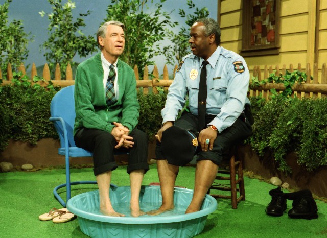 As they did before, Mr. Rogers (Fred Rogers) and Officer Clemmons (Franois Clemmons) cool their feet off together in a kiddie pool in a "Mister Rogers' Neighborhood" clip seen in the documentary "Won't You Be My Neighbor?"