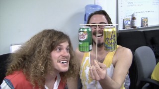 Kyle Newacheck amuses Blake Anderson with his soft drink can balancing act in "Behind the Scenes in the Writers Room."
