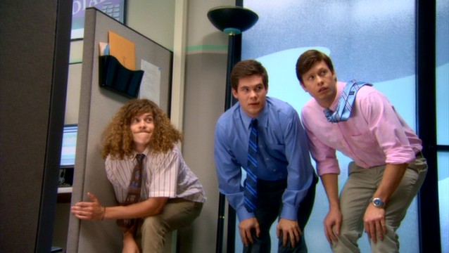 Blake (Blake Anderson), Adam (Adam DeVine), and Anders (Anders Holm) try to avoid notice while holding a suspiciously crouched position.