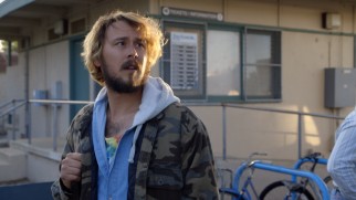 Karl (Kyle Newacheck), the guys' abandoned drug dealer, is left waiting for nobody at a bus stop in "True Dromance."